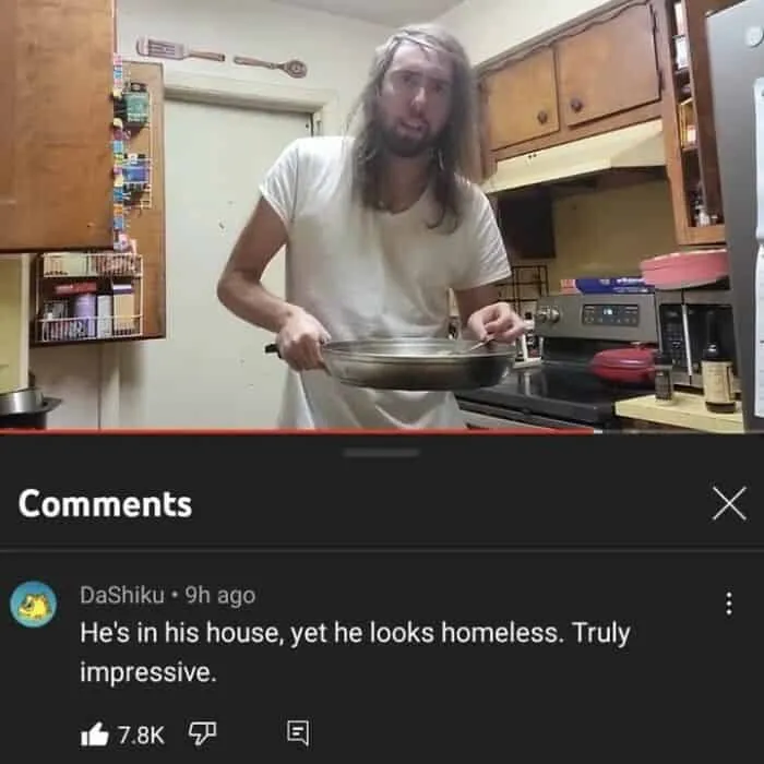 A man holding a pan in a kitchen with funny and oddly accurate insults comment about his appearance below.