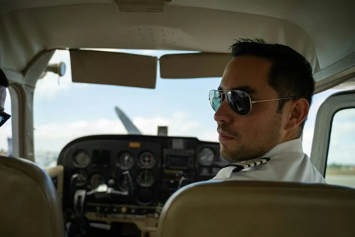 A pilot in an airplane cockpit looking back after a major slip-up.
