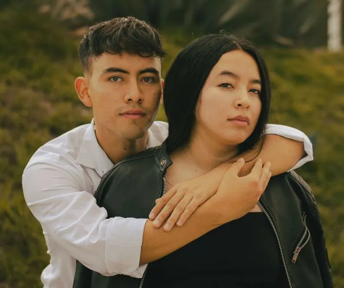 Young couple outdoors showing support amid microaggressions discussion