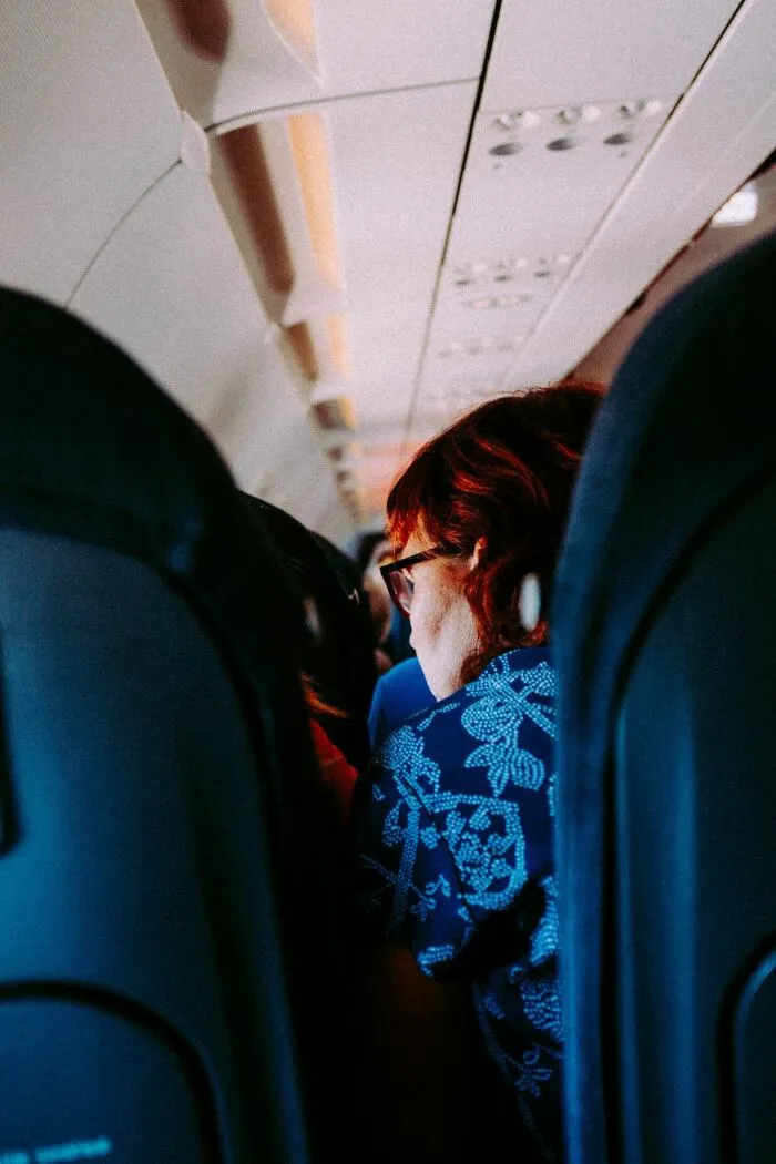 Passengers sitting in airplane seats looking for comfortable flights
