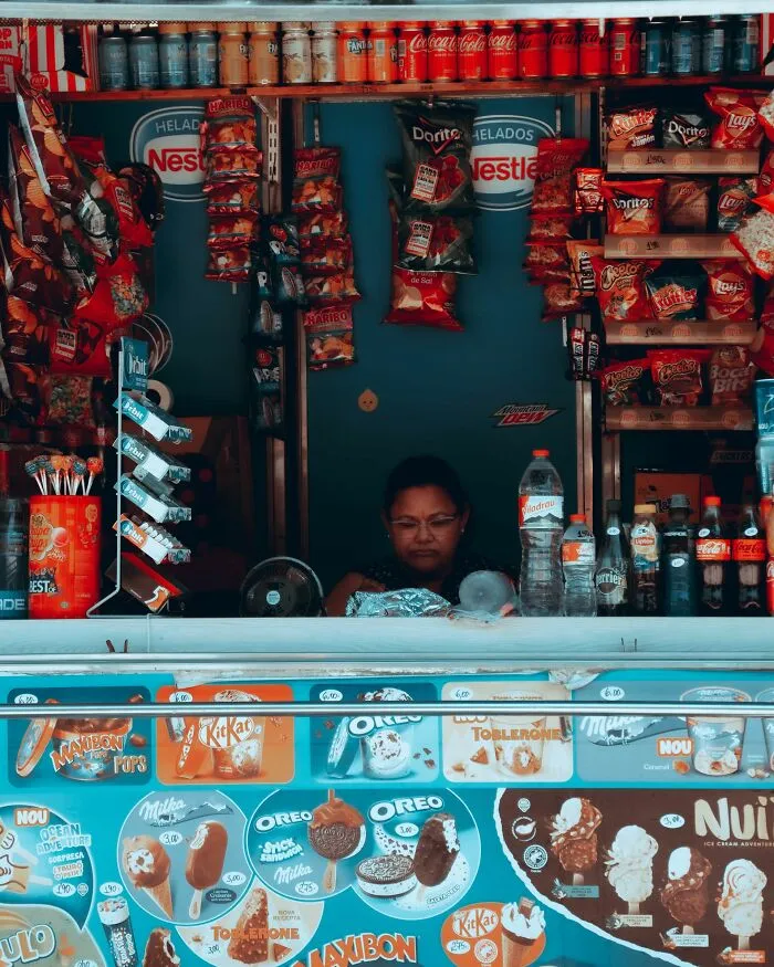 Snack stand displaying Nestlé products and other brands among companies people refuse to buy from