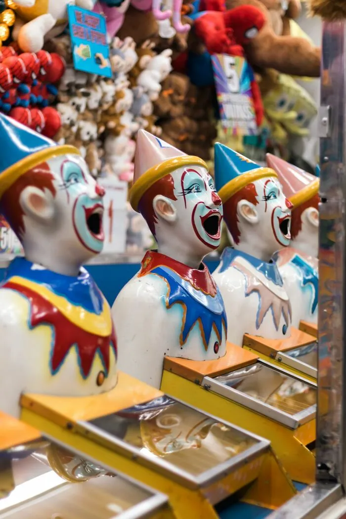 Spooky carnival clown game giving an urgent feeling to run away