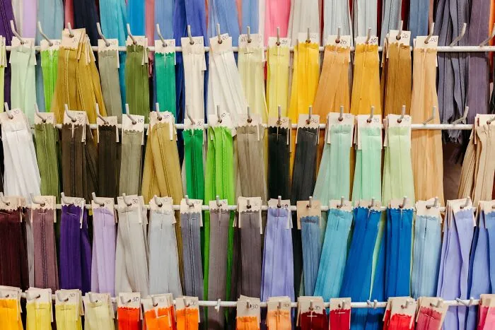 Colorful fabric ribbons hanging on display racks