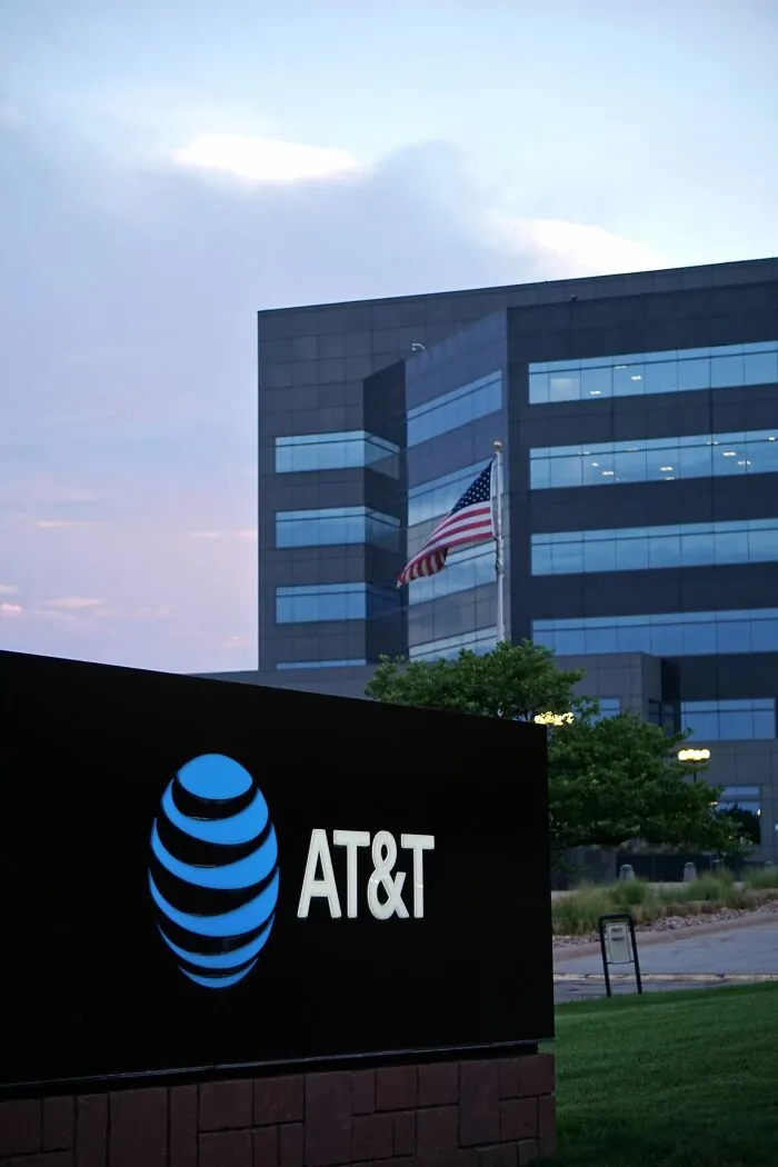AT&T logo and corporate office building associated with companies consumers refuse to support
