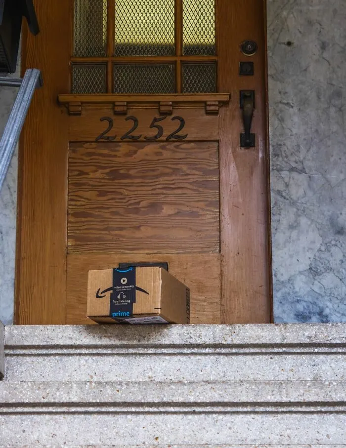 An Amazon package delivered to a front door showcasing clever life tricks
