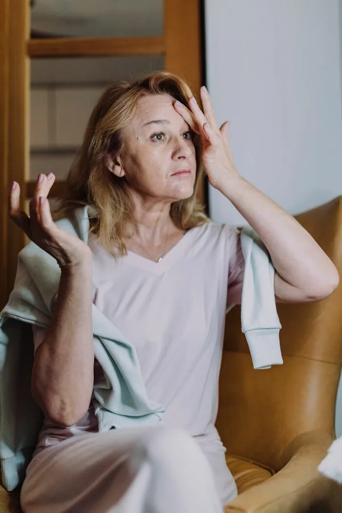 Middle-aged woman frustrated in conversation depicting Karen behavior