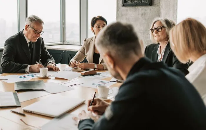 Diverse team in business meeting, discussing microaggressions impact
