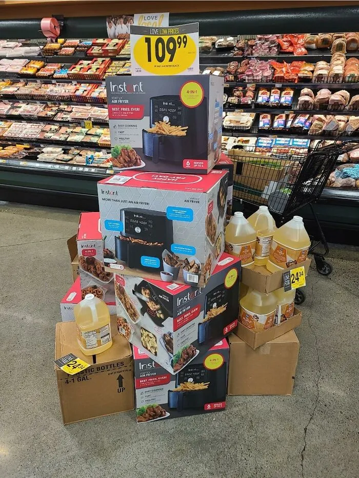 A display of air fryers next to cooking oil highlighting advertising fails