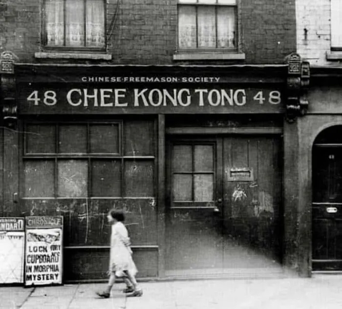 Rare historical photo of Chinese Freemason Society building with two children walking by