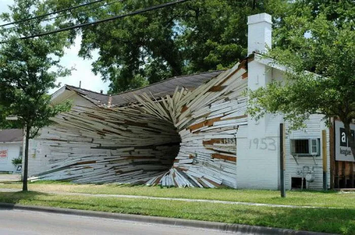 White house with exterior designed to look like exploded wood panels