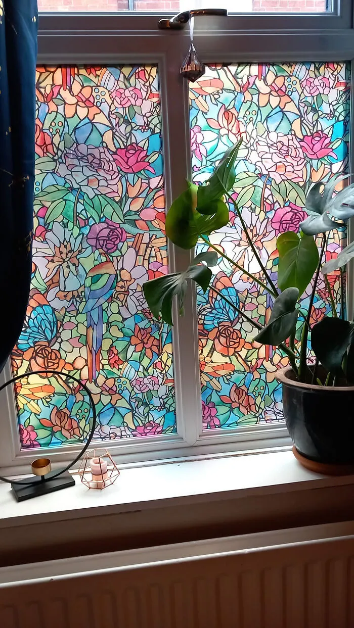 Window decorated with colorful stained glass film as a creative home makeover project