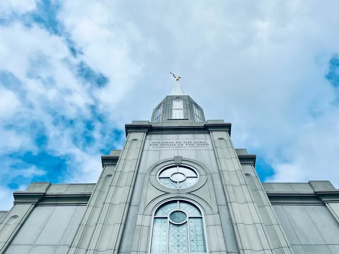 Religious building with spire and blue sky
