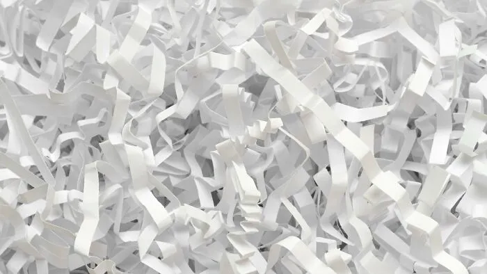 Close-up of shredded paper symbolizing hidden or destroyed secrets