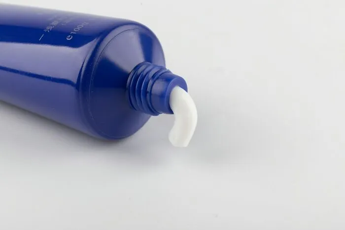 Ointment squeezed out of a blue tube, offering brilliant tips for skincare.