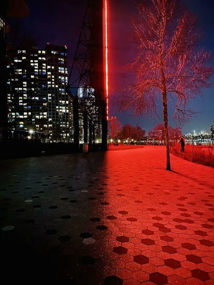 A perfectly confusing photo showing a split night scene divided by red glow and dark shadow.
