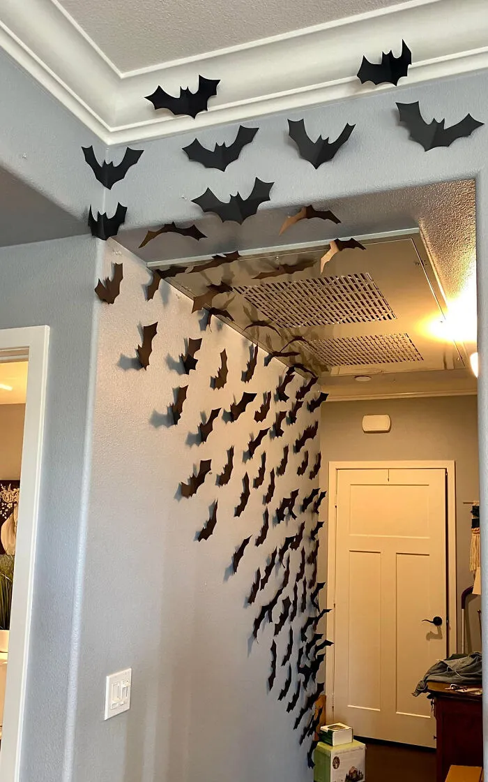 Swarm of paper bats decorates the hallway and ceiling of homes for Halloween.