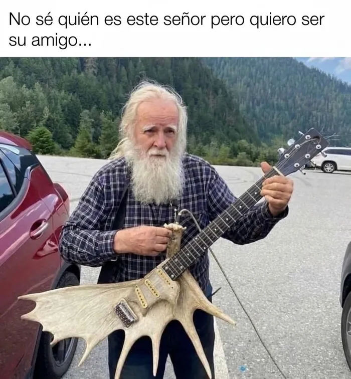 Anciano con una guitarra de asta, estilo de vida de memes sobre paletos americanos.
