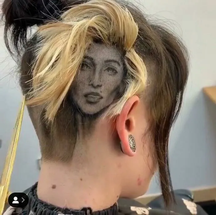 Un espectacular peinado artístico con el rostro de una mujer que demuestra un talento increíble.