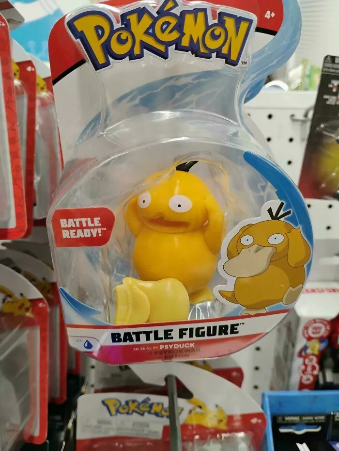 Juguete de Psyduck con diseño divertido y fallido en caja Pokémon.