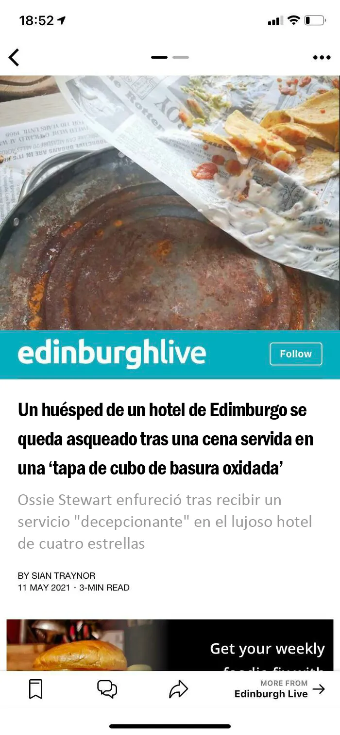 Nachos en una tapa de cubo de basura oxidada  