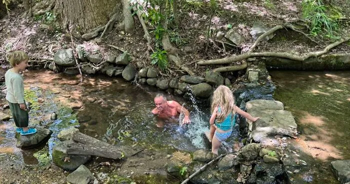 Health Secretary RFK Jr. Swims With Grandkids In Creek Flowing With Sewage and Bacteria